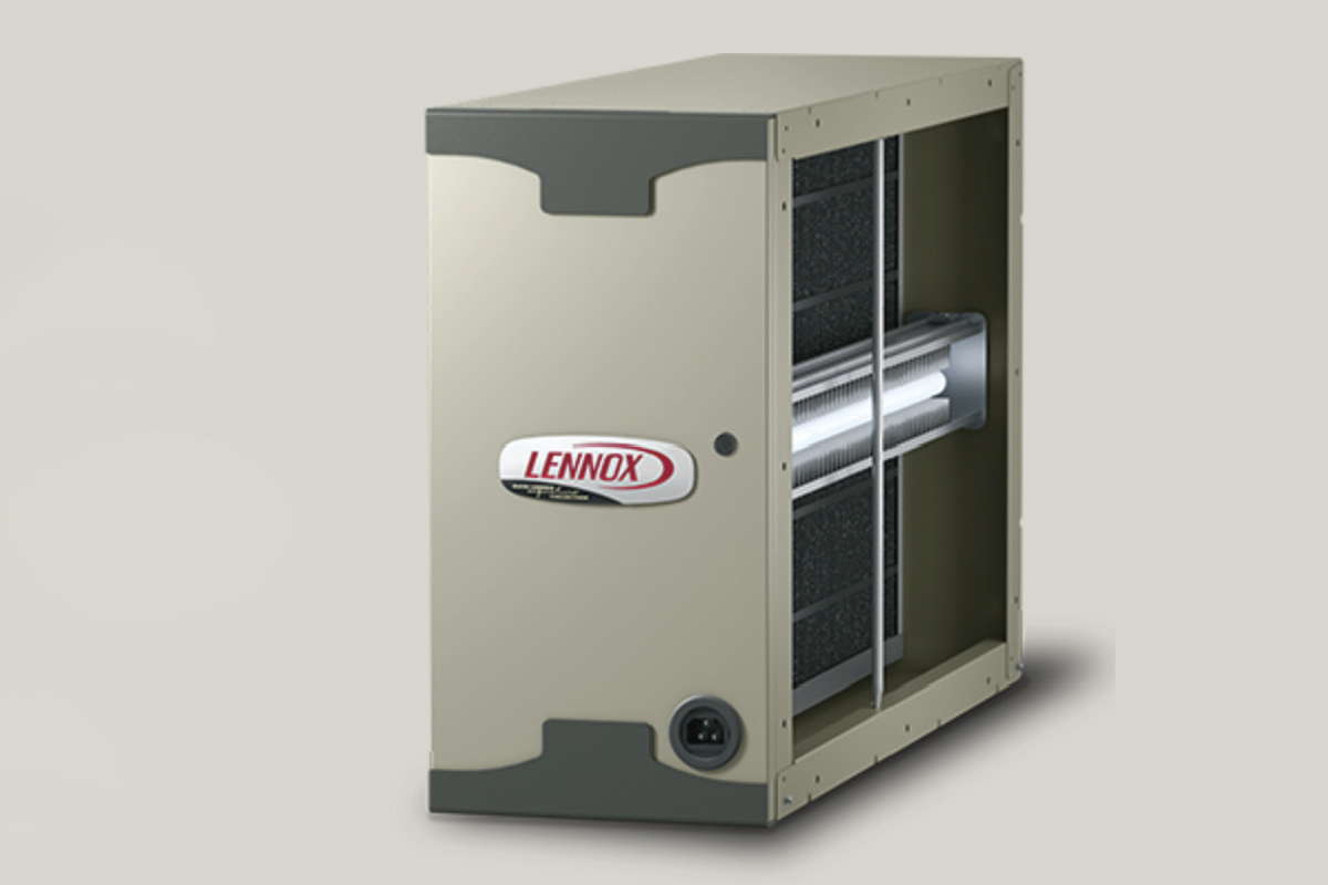 A beige and gray Lennox PureAir Systems air purifier unit with a visible internal filter and the Lennox logo on the front, set against a plain light background.