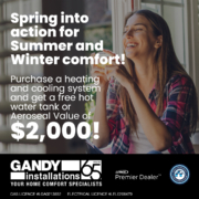 A smiling woman enjoys a hot drink indoors. Promotional text offers a free hot water tank or Aeroseal worth $2,000 with purchase of a heating and cooling system from Gandy Installations. Logos and license numbers are shown.
