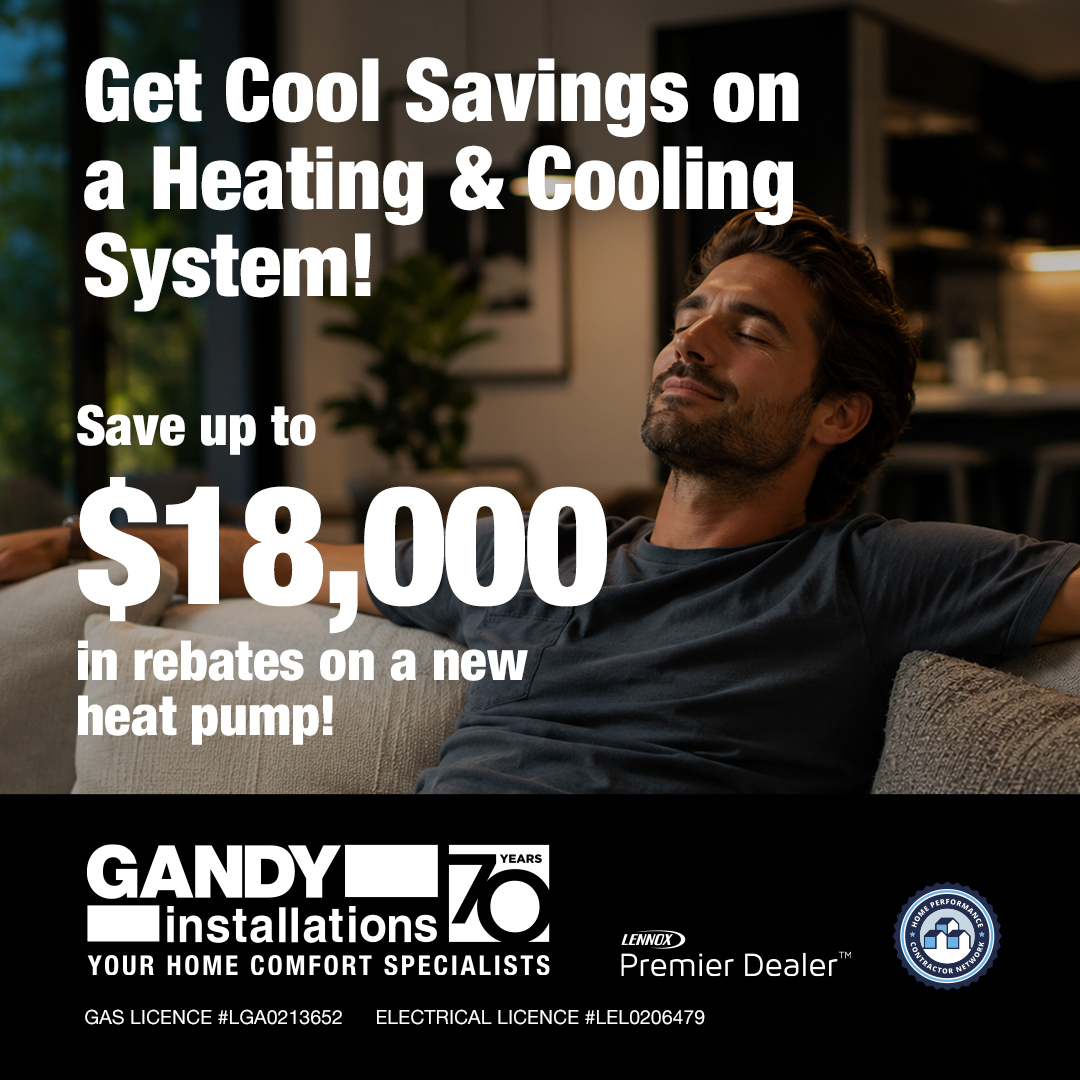 A relaxed man reclines on a sofa in a cozy living room. Text beside him advertises up to $18,000 in rebates on a new heat pump from Gandy Installations, with heating and cooling system savings. Logos and licenses shown.
